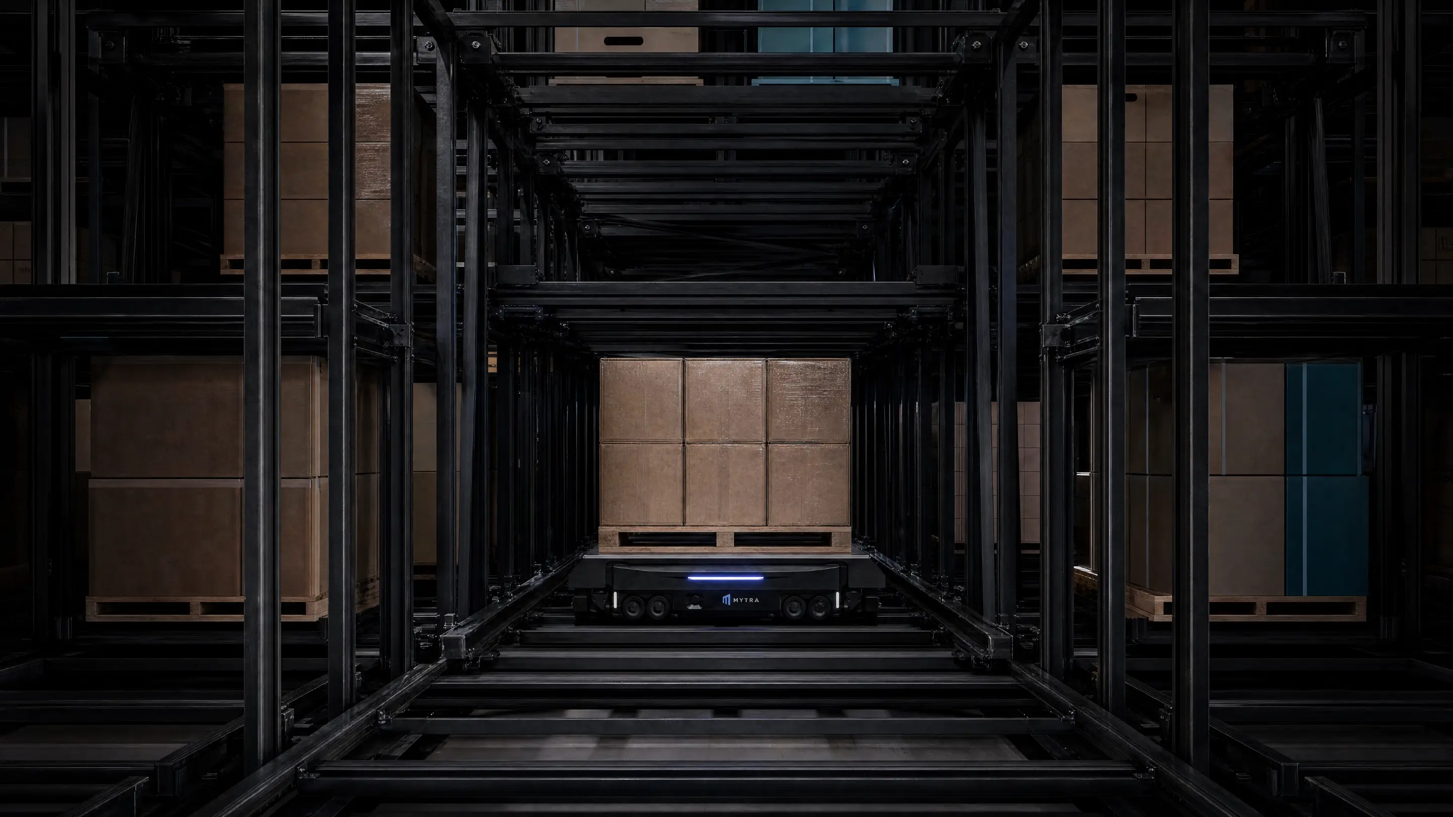 Dark metal framework exhibition space with minimalist architectural design and centered viewing area.