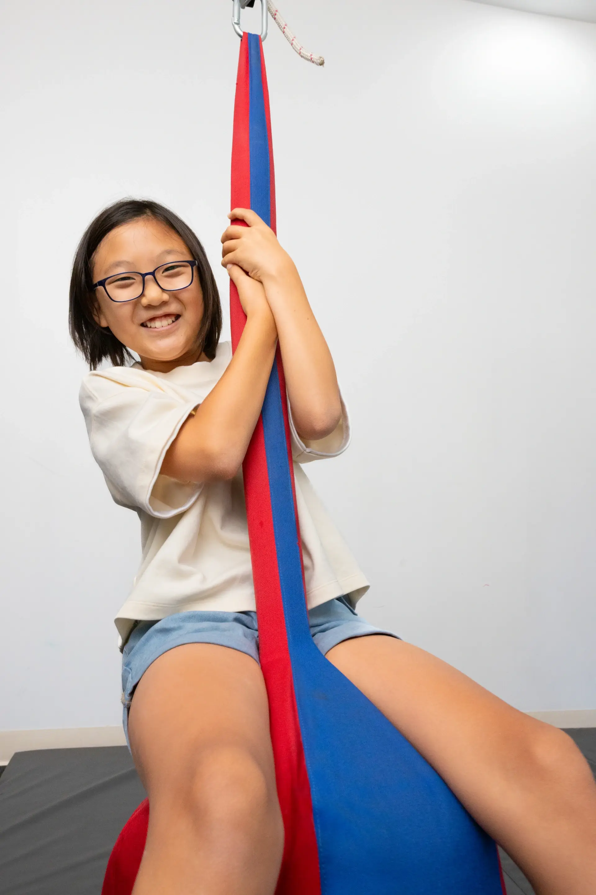 Swing work, therapist at her side