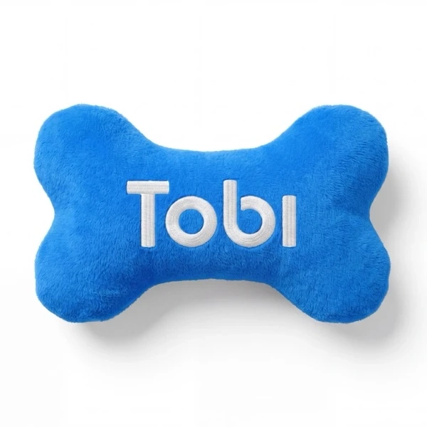 A plush Tobi bone pillow