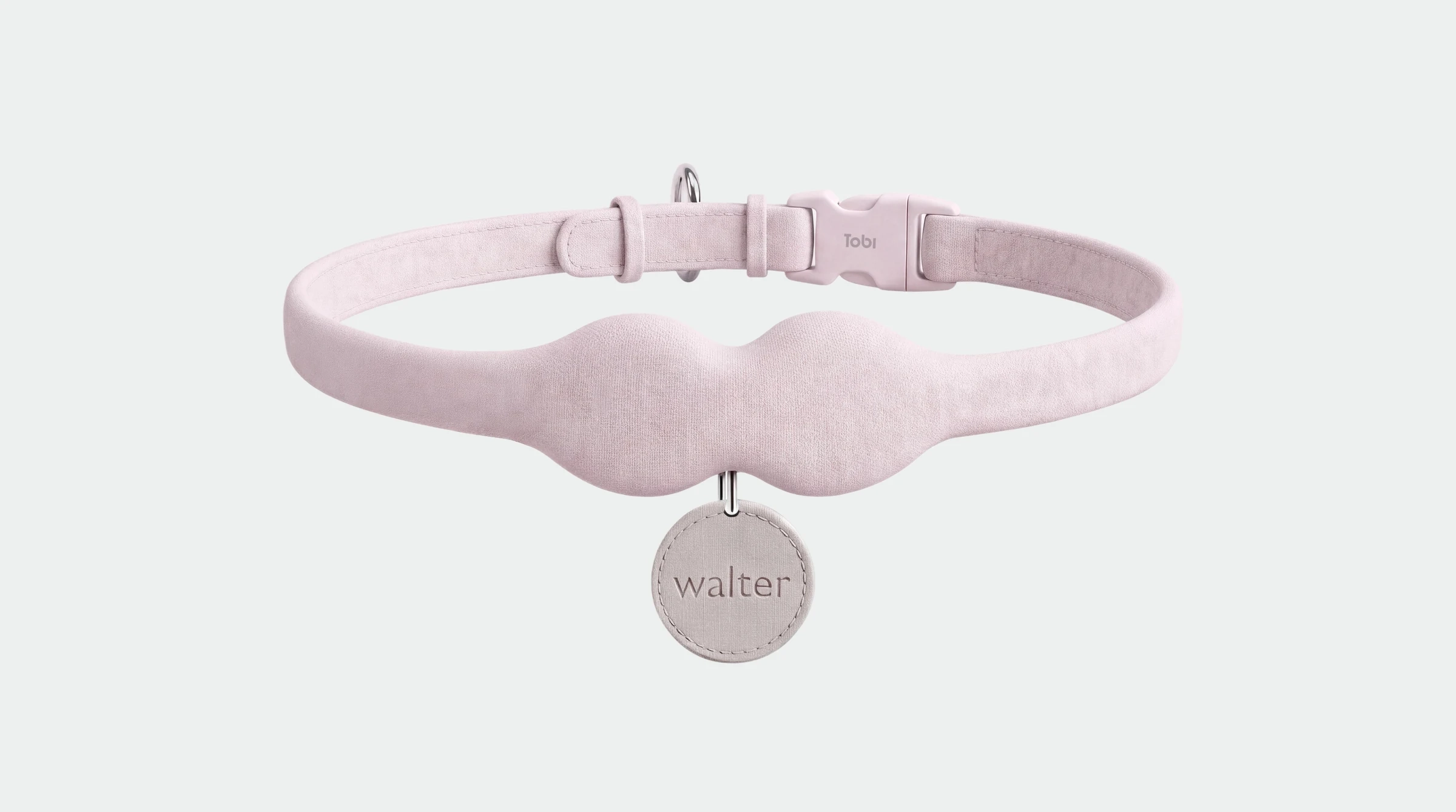 The Tobi collar in rose pink, with a name tag reading walter