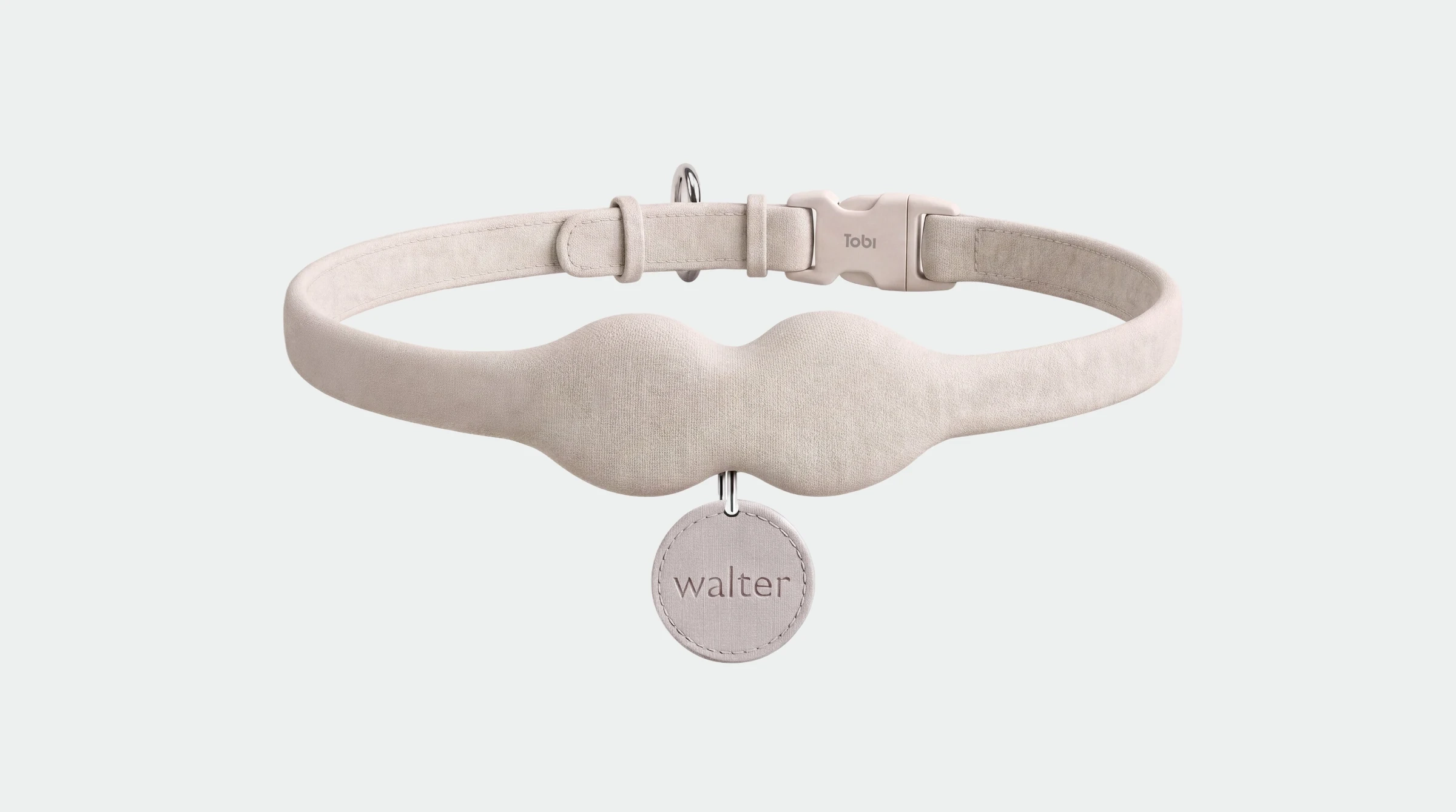 The Tobi collar in sand, with a name tag reading walter